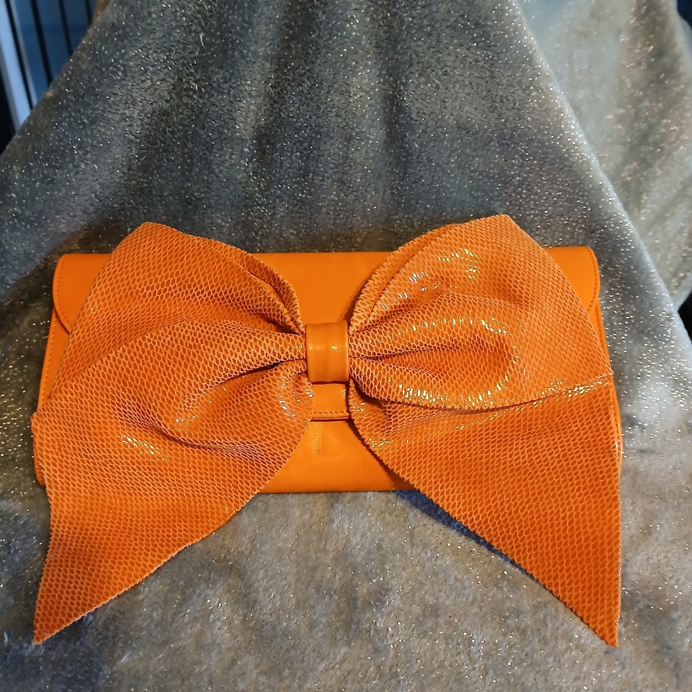Elegant Orange Clutch with Bow Accent